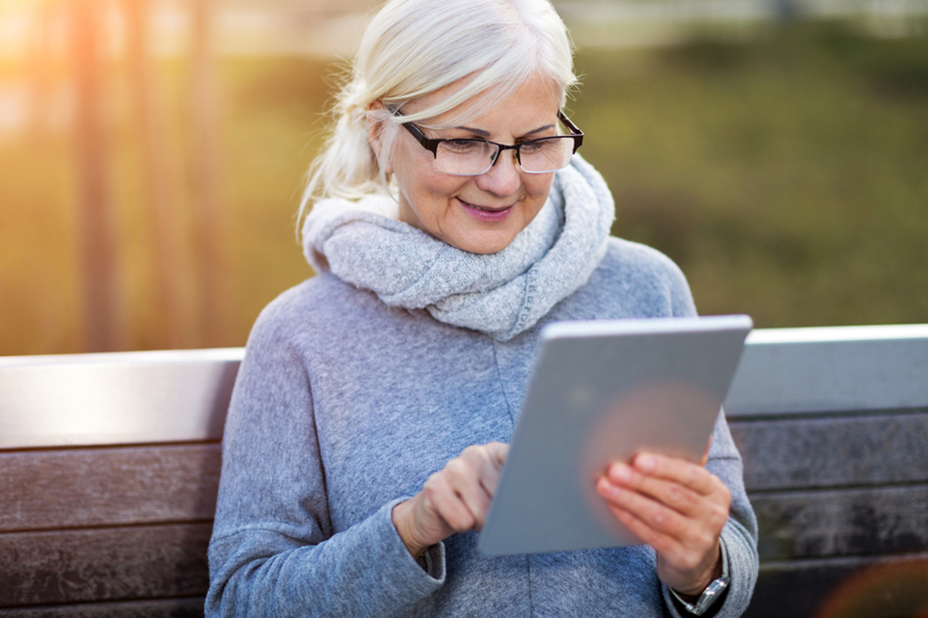 Smiling woman typing on her laptop.